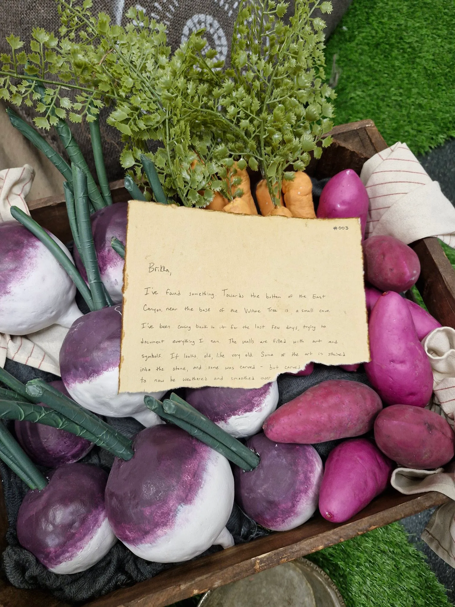 Brikka,

I've found something. Towards the bottom of the East Canyon, near the base of the Vulture Tree is a small cave. I've been coming back to it for the last few days, trying to document everything I can. The walls are filled with art and symbols. It looks old, like very old. Some of the art is stained into the stone, and some was carved - but carved [...] to now be weathered and smoothed over. [...]